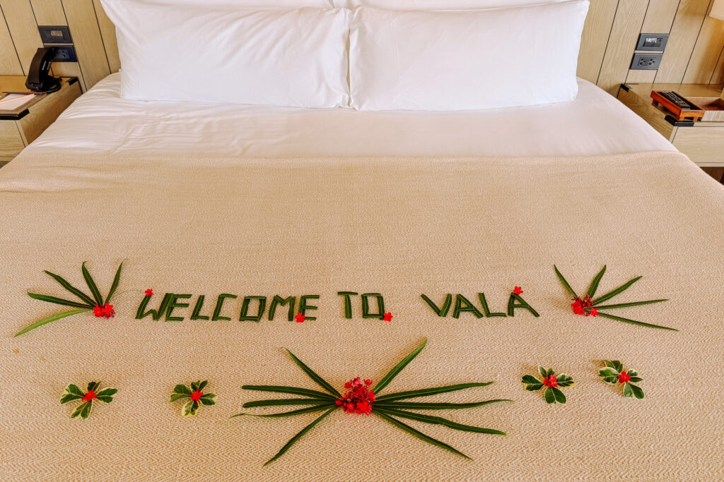 Bed decorated with Welcome to Vala